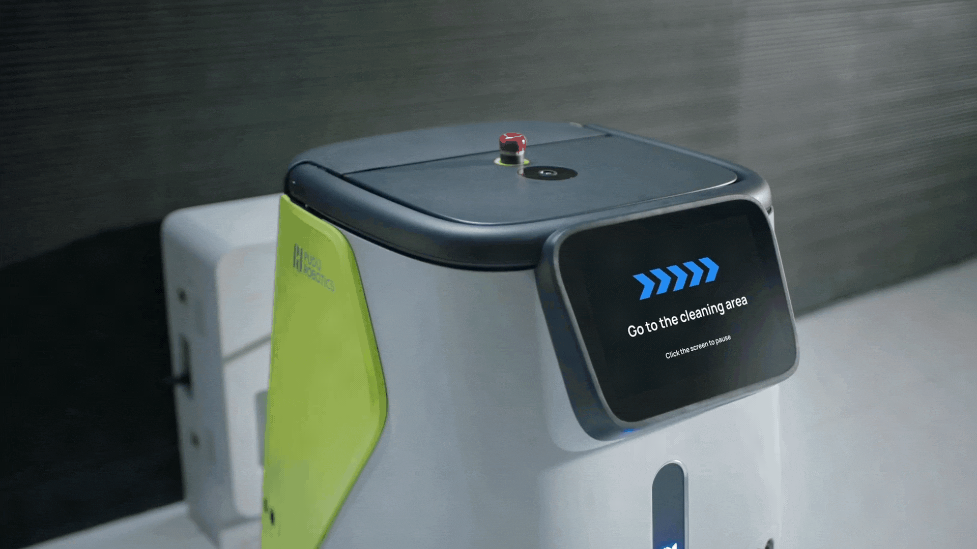 robot charging station for cleaning a facility