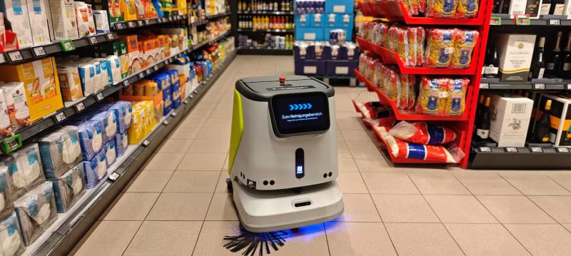 robot cleaning a gas station floor