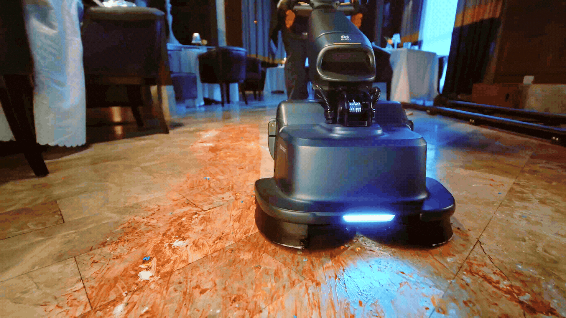 pudu robot helping an employee