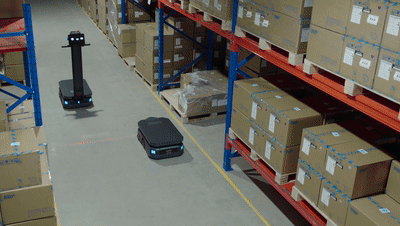 pudu robots moving heavy boxes